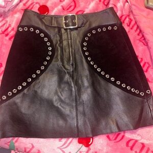 Maje
Leather Black mini Skirt with Studded Accents